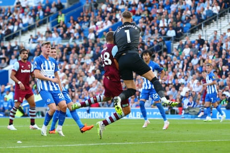 Tomas Soucek of West Ham United and Brighton keeper Bart Verbruggen collide as they battle for the ball.