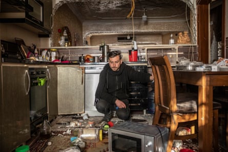 Barış Yapa in the kitchen of his house badly damaged by the earthquake.