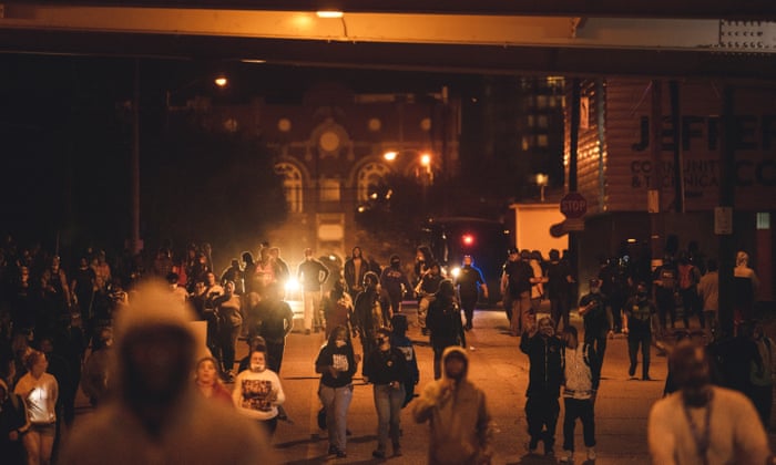 Protesters march under an overpass downtown in Louisville, Kentucky.