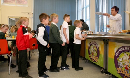 Pupils line up for breakfast at Forest Academy.