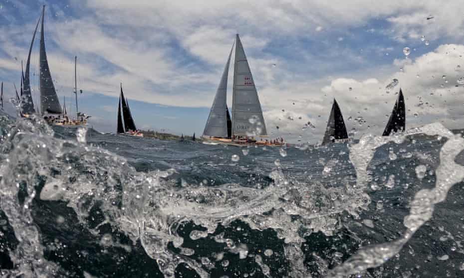 The fleet sails out of the heads during the 2021 Sydney to Hobart yacht race start