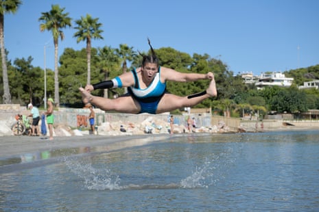 Eva Petrosian, 17, a member of the Amazons cheerleading team in Athens, Greece, practises on  Varkiza beach