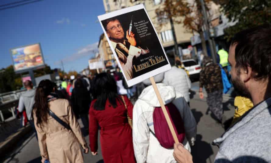 An anti-vax protester holds a Bill Gates poster during a objection successful Bulgaria.