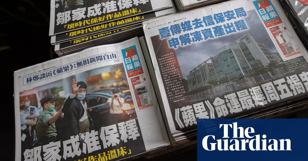 Hong Kong police arrest editorial writer at Apple Daily newspaper