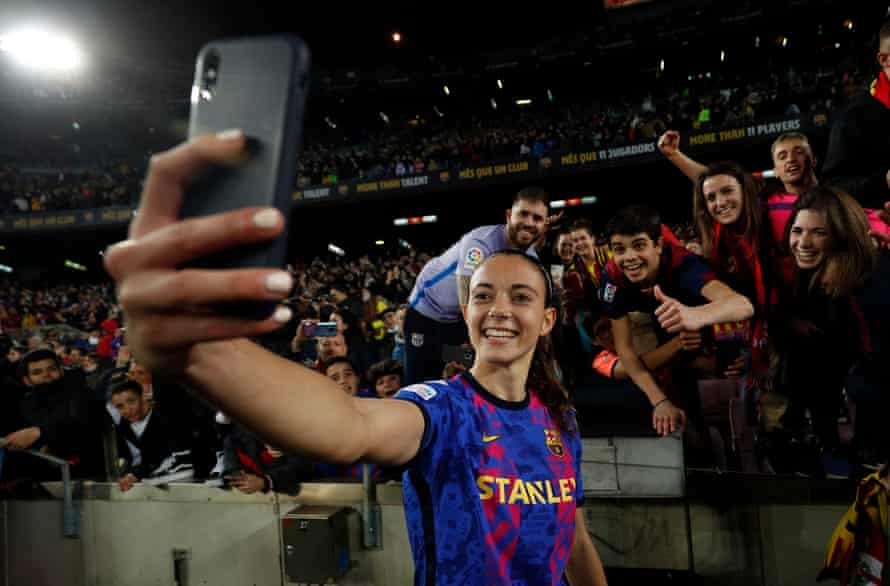 Barcelona’s Aitana Bonmati take a selfie with fans as she celebrates after the match.