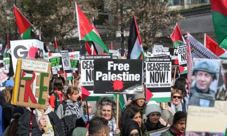 National March For Palestine, London, 9 March 2024 – large crowd carrying flags and placards with messages including 'Free Palestine' and 'Ceasefire Now'