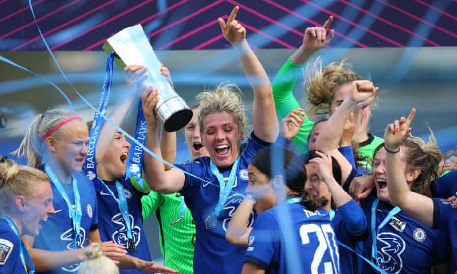 Chelsea players celebrate with the trophy after securing the WSL title last season.