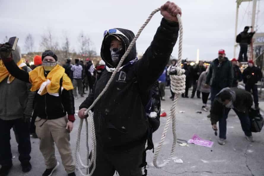 A man holds a noose as pro-Trump rioters breach the security perimeter and penetrate the US Capitol on 6 January. The mob chanted: ‘Hang Mike Pence.’