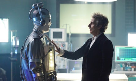 Peter Capaldi in a scene from Doctor Who, in profile; reaching out and touching a person in full-body armour
