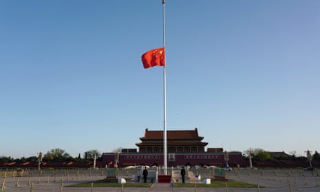 The Chinese national flag flies at half-mast in Tiananmen Square in Beijing to mourn those who died in the fight against coronavirus.