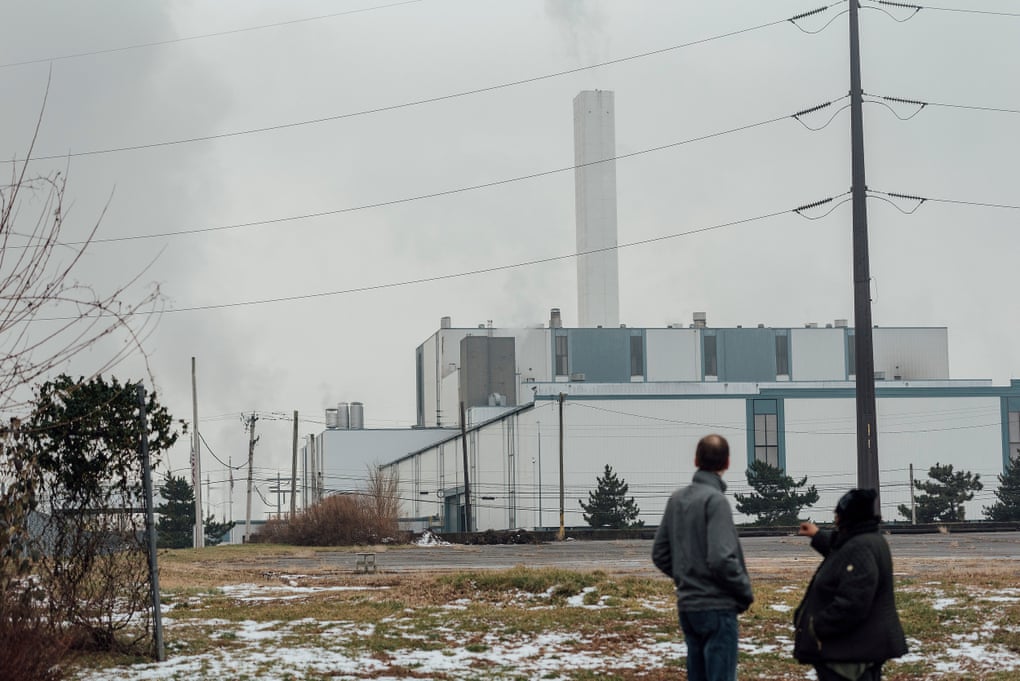 Activists Mike Ewall, left, and Zulene Mayfield stand in front of the Covanta incinerator in Chester, Pennsylvania. The incinerator brings in garbage from New York, Ohio and other states.