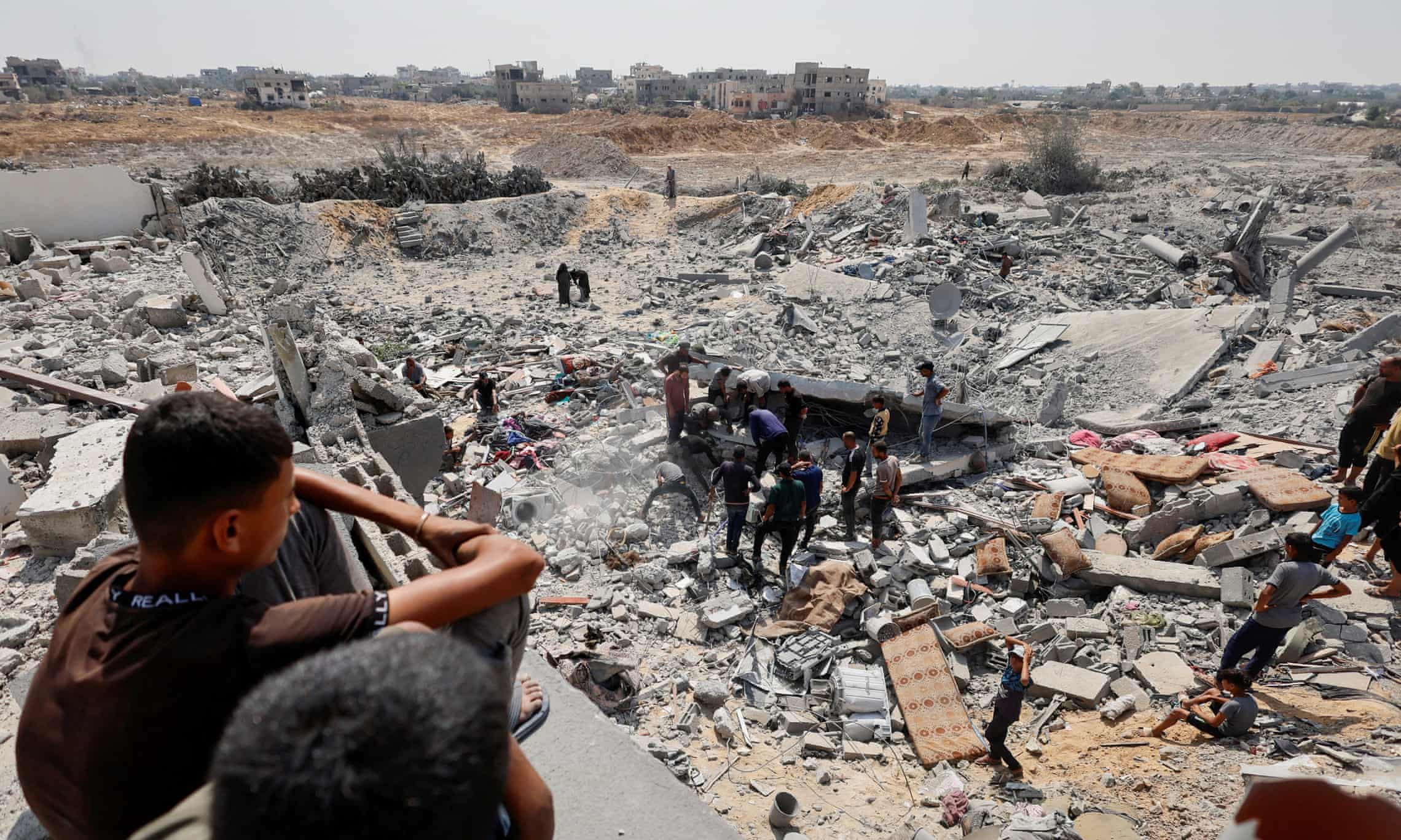 Children view site of Israeli strike in Gaza
