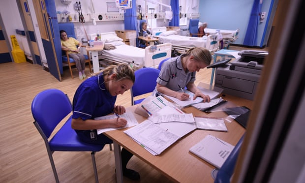 Members of clinical staff complete paperwork in the Accident and Emergency department of the 'Royal Albert Edward Infirmary' in Wigan, north west England.