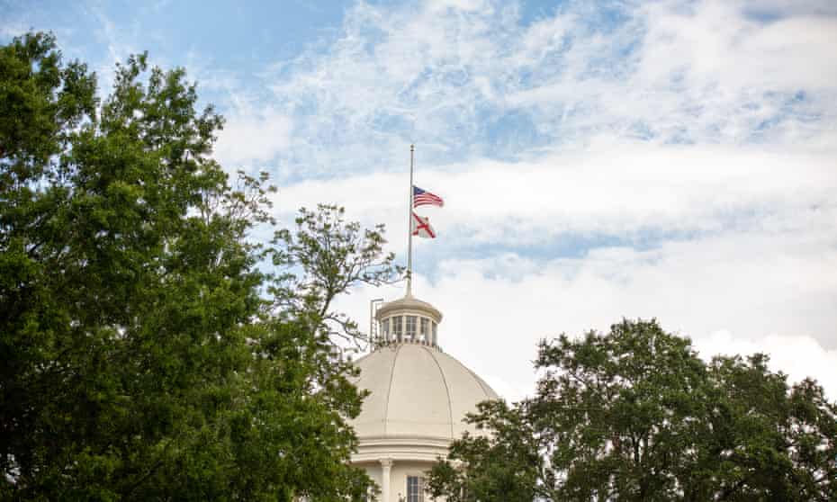 Flags at the Alabama state capitol in Montgomery. The affected church is in a small community called Strawberry, about 60 miles north-east of Birmingham.