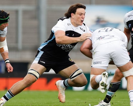Tom Hooper grappling with another rugby player