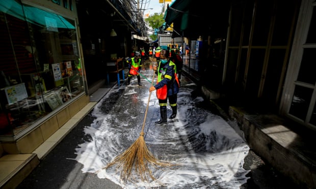 A Bangkok market is cleaned after a worker tested positive