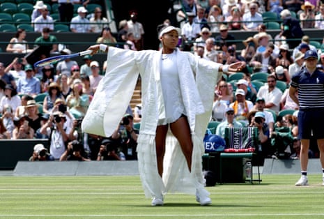 Naomi Osaka of Japan arrives on Court No.1 for her Women’s Singles third round match against Daria Kasatkina of Australia at the Wimbledon Championships in London wearing Japanese style white robes