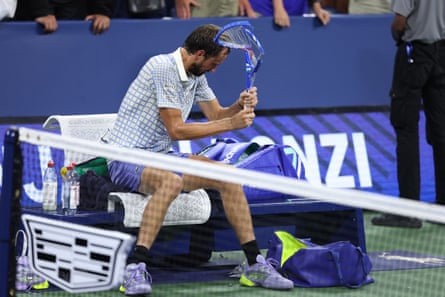 Daniil Medvedev breaks his racket after losing his match against Benjamin Bonzi.