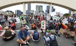 Activists from Extinction Rebellion (XR) take over the William Jolly Bridge during protests in Brisbane, 11 October 2019.