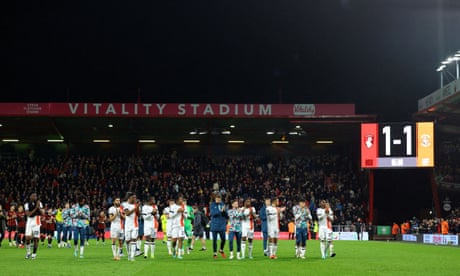 Luton’s players applaud their fans after the match at Bournemouth was abandoned.