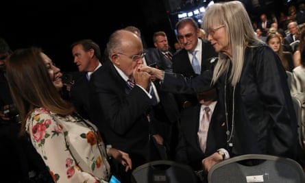 Former New York City mayor Rudy Giuliani kisses the hand of Miriam Adelson before the first presidential debate in September 2016.
