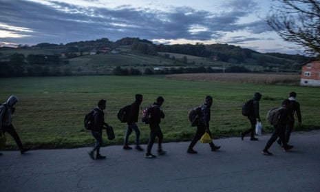 Migrants gather before trying to cross the Bosnia-Croatia border near Velika Kladusa.