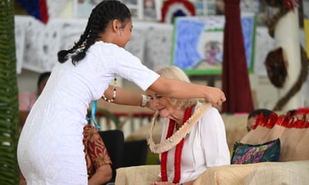 Queen Camilla is presented with a gift at Moata’a village’s aoga faifeau (pastor’s school) in Samoa.