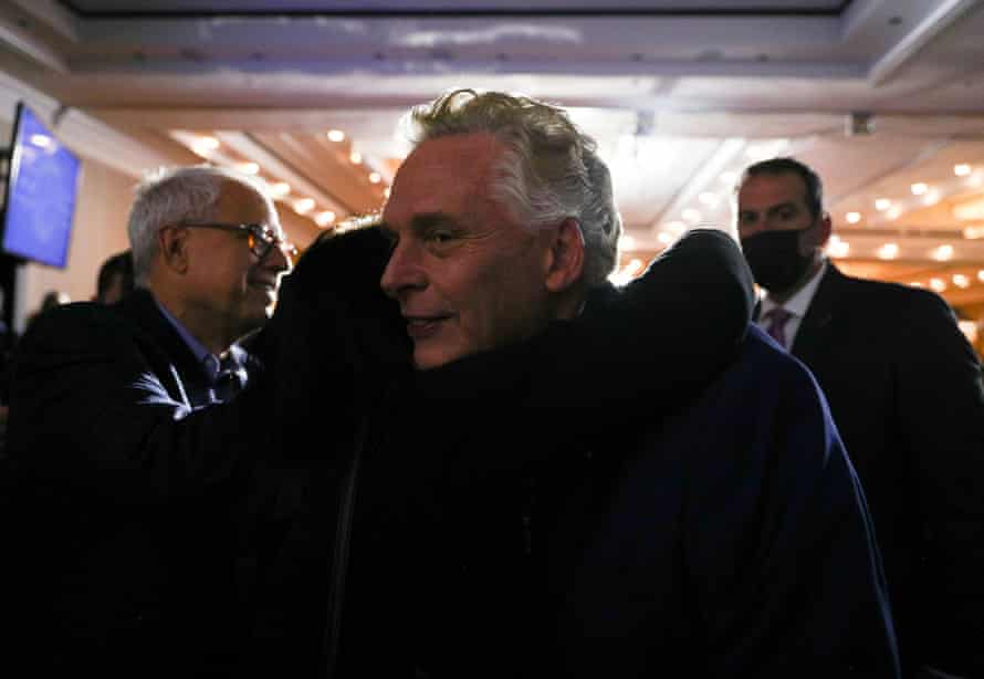Terry McAuliffe is consoled by a supporter in the crowd during his election night party and rally in McLean, Virginia.