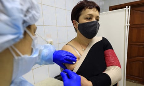 A volunteer receives EpiVacCorona vaccine injections against COVID-19 in Russia