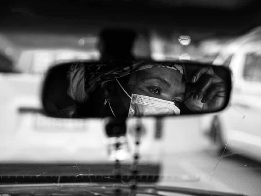 Ghost riders: the invisible lives of Johannesburg food couriers – photo essay | South Africa 19 Londi in traffic while taking a delivery