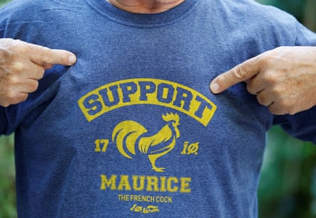 A man wears a T-shirt in support of Maurice, whose loud crows landed him in court accused of noise pollution.