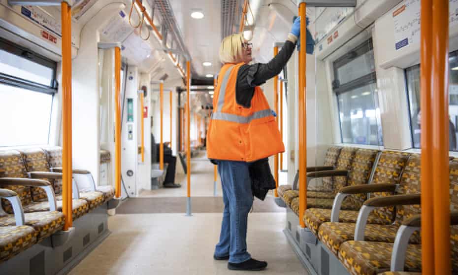 A TFL worker cleaning a London Overground train, 20 March 2020