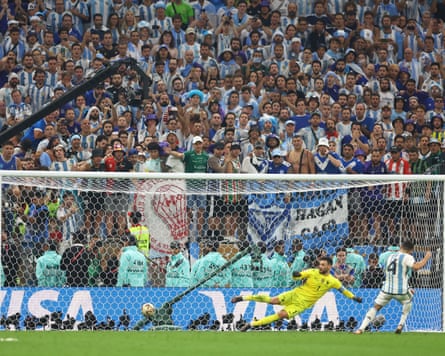 The Argentina footballer Gonzalo Montiel (wearing No 4) scores a penalty past the France goalkeeper Hugo Lloris (wearing No 1) to win Argentina the 2022 World Cup.