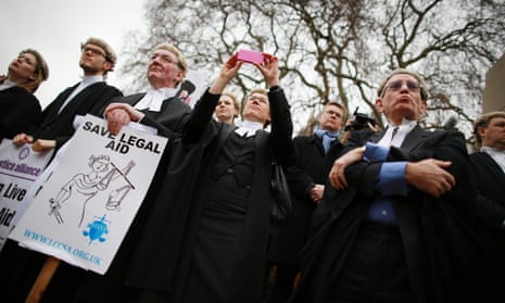People at a protest against legal aid cuts