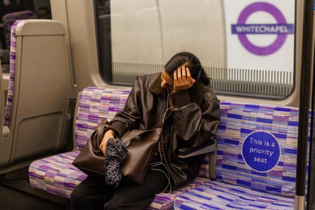 A tired commuter on the Elizabeth line
