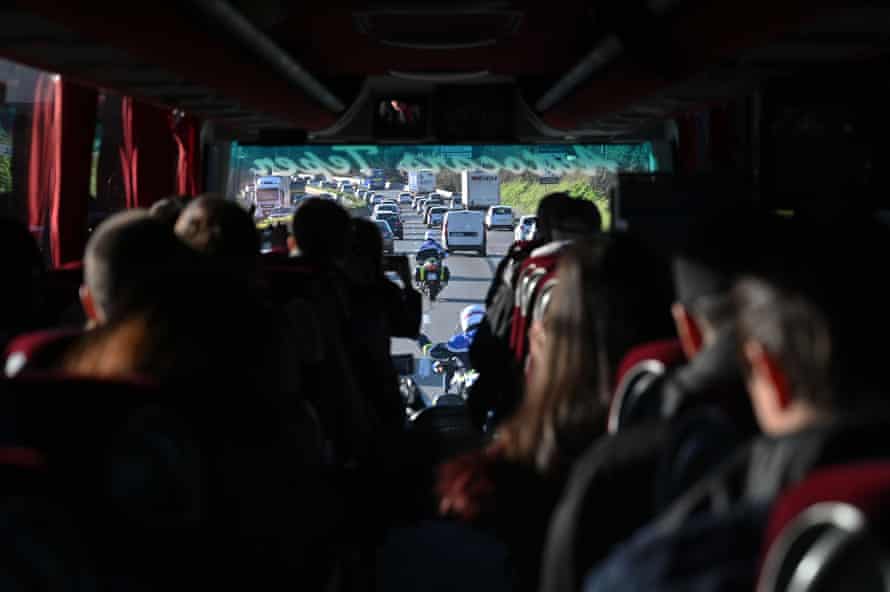 Police escort a bus transporting French citizens after leaving The Vacanciel Holiday Resort in Carry-le-Rouet, near Marseille, southern France on early February 14, 2020, where they spent 14 days in quarantine after their repatriation from Wuhan