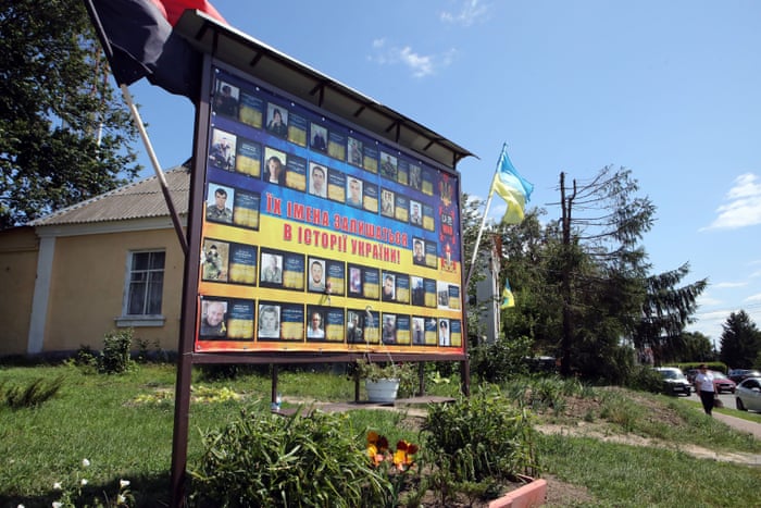 Russia-Ukraine war: Kyiv and Moscow sign deal to allow grain exports from blockaded Black Sea ports – live 10 The photographs of perished Ukrainian defenders are pictured in a settlement that was liberated from Russian invaders in Bucha district.
