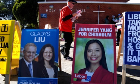 Placards outside a polling station in the outer Melbourne electorate of Chisholm where fake AEC-style signs in Mandarin told voters to give their first preference to the Liberal party.