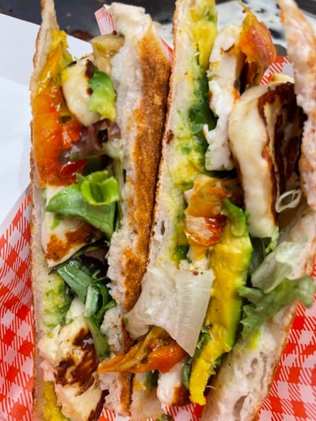 a flatbread sandwich with a rainbow of fillings