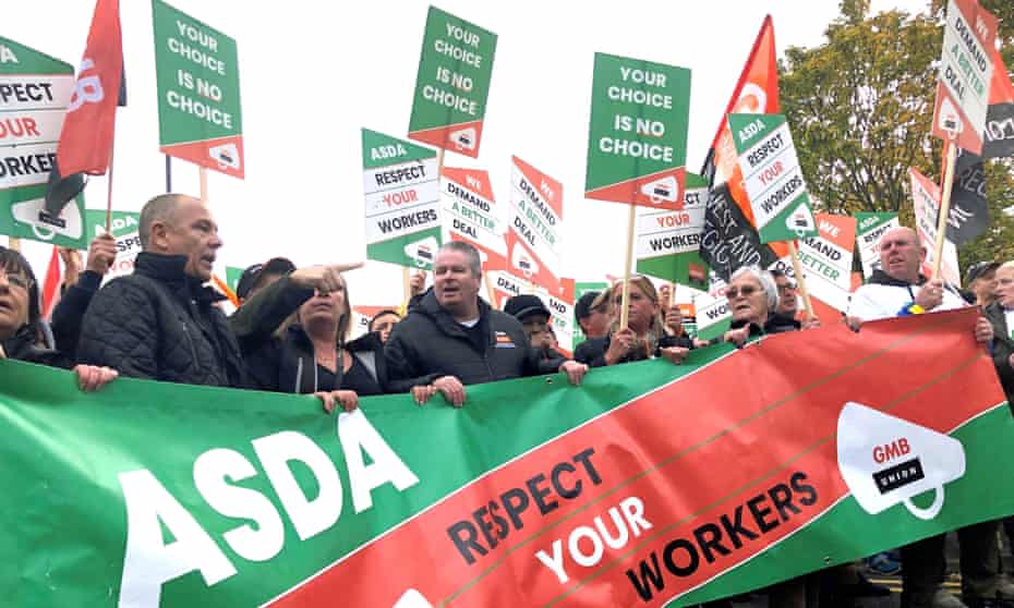 Asda workers marching through Leeds to the company’s headquarters in opposition to the new contract.