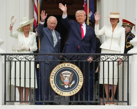 Donald and Melania Trump, and King Charles and Queen Camilla wave from the Blue Room balcony during the state visit arrival ceremony.