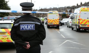Police at the scene of a terrorism-related raid in Dewsbury, West Yorkshire