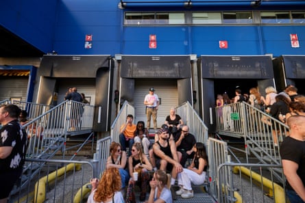 ravers taking a break from the dancefloor by the former loading bays.