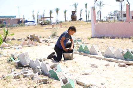 Palestinians, who had to take refuge after the intense Israeli attacks on Rafah city, try to maintain their daily lives under difficult conditions at makeshift tents al-Mawasi area of Khan Younis