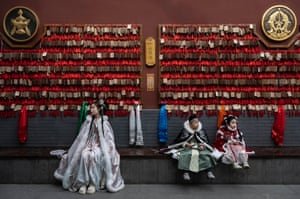 Tourists in traditional Hanfu at a Buddhist temple
