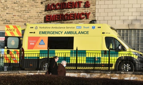 People walks past a accident and emergency department sign in front of an ambulance outside Bradford Royal Infirmary hospital