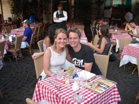 Natalie and Brent at a dining table on holiday
