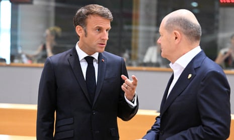 French President Emmanuel Macron (L) and the German Chancellor Olaf Scholz (R) attend the European Council Summit at EU headquarters in Brussels, Belgium, on 30 June.