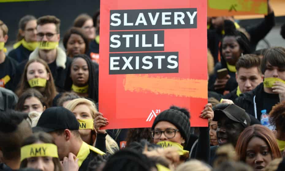 Activists march in London to protest against modern slavery.