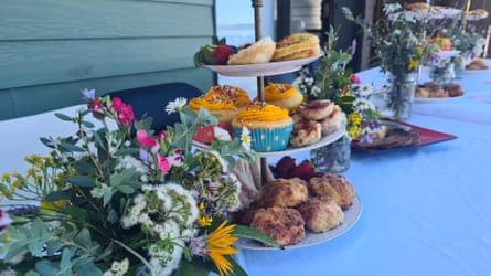 A table set with cakes and flowers